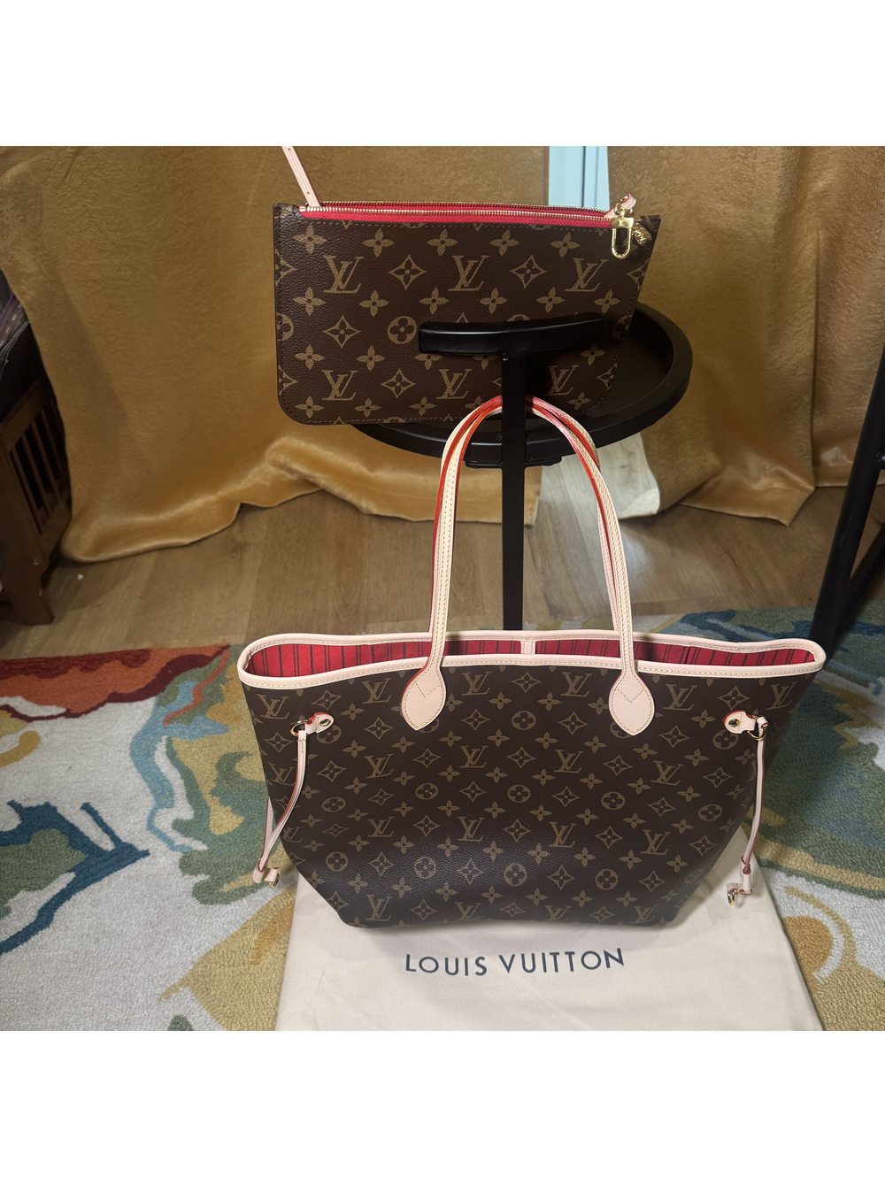 Louis Vuitton Monogram Neverfull tote bag with pink and red striped interior